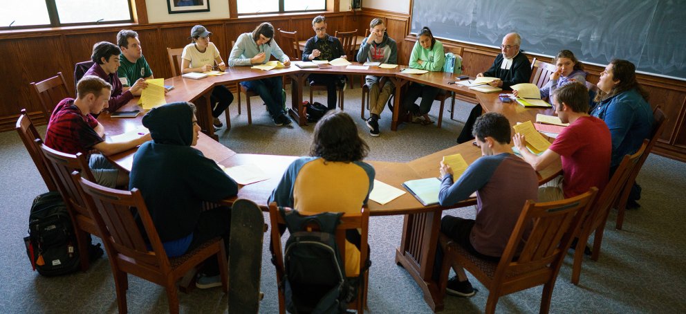 Seminar class with a round table with Bro Cardwell