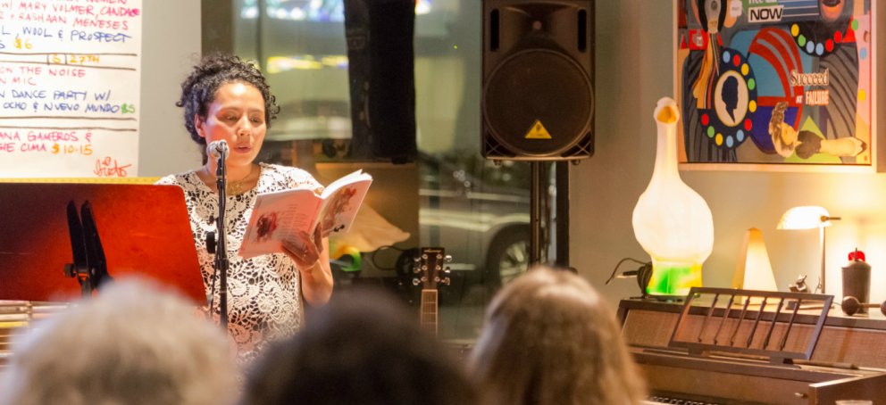 An MFA student reads to an audience.
