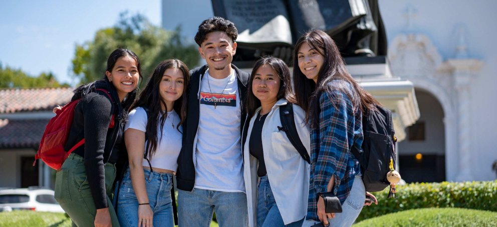 Students standing together in a group smiling on Saint Mary's College Campus