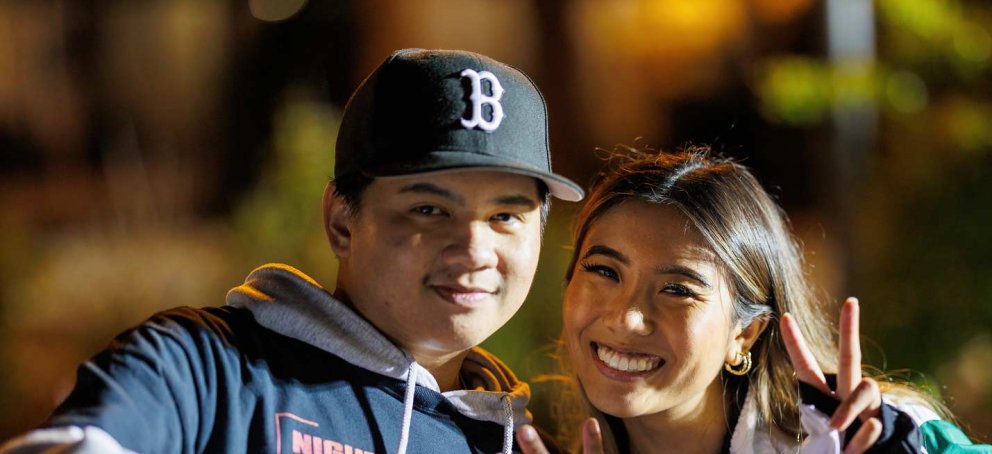 Students smiling at the night market
