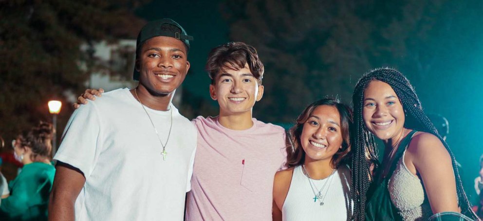 Students smiling at a carnival
