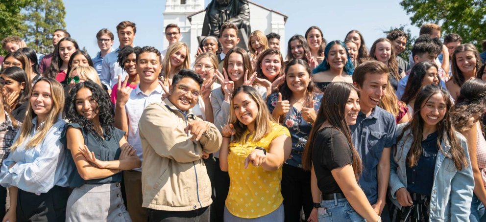 Students standing together in front of the saint mary's college chapel