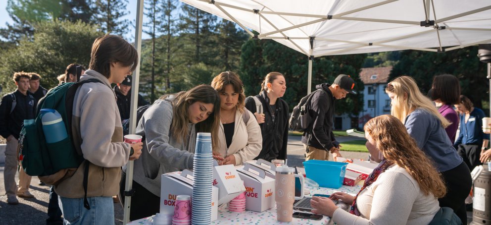 Students line up at Wake Up Wednesday to grab donuts and coffee 