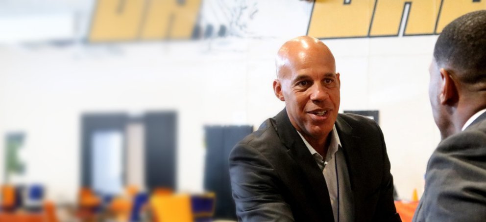 adam clark shaking hands