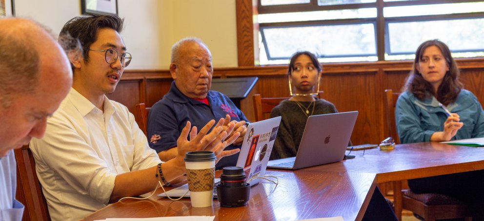 Students and faculty participating in a seminar discussion