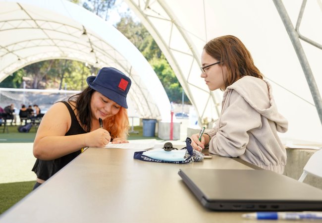 Students in an outside classroom working together