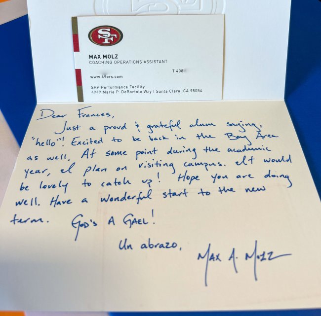 A handwritten note and business card