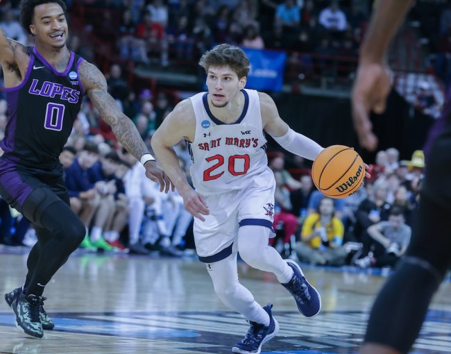 Men's basketball player Aidan Mahaney drives against GCU in 2024 NCAA Tournament