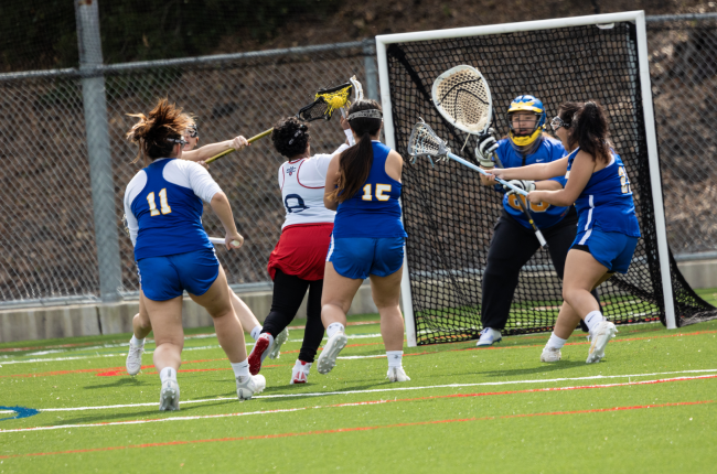 No. 8 Ariam Semere ‘24 shoots for the goal in the match against the Spartans.