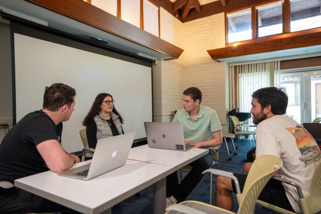 Andrew Aroutynov '24 and other students at the Data Science Club