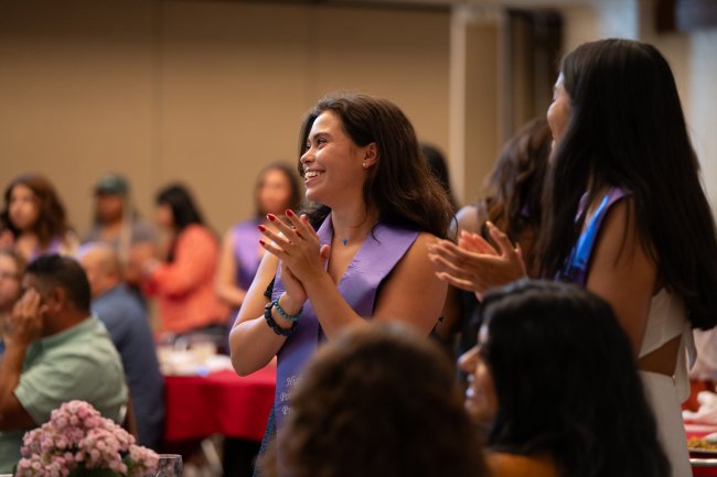 Students applauding at HP Grad Celebration 2024