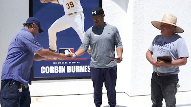 Cesar Gallo and Jose Valera are presented awards by Baseball Coach Eric Valenzuela, 2024