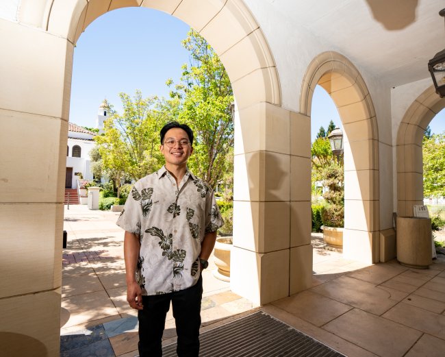 Jian Bumatay posing in a hallway