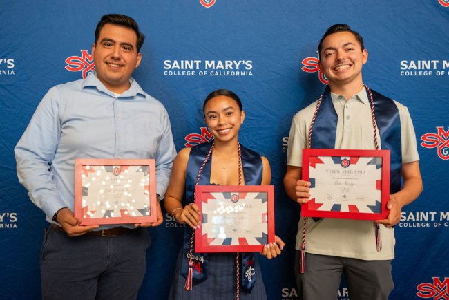 Three students from Club Sports hold certificates they were awarded at 2024 Student Leadership Awards