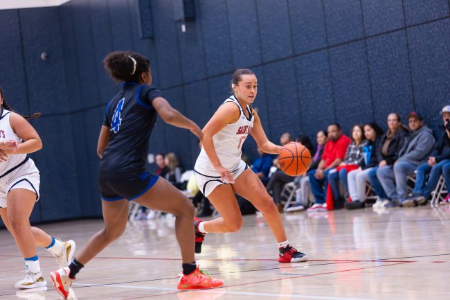 Pushing forward: Amira Cebalo ’27 dribbles past a defender during the Women’s Club Basketball game at the Joseph L. Alioto Recreation Center. / Photo by Rebecca Harper