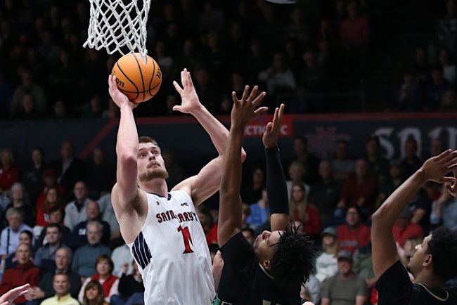 Men's basketball player Mitchell Saxen shoots against Cal Poly in November 2024