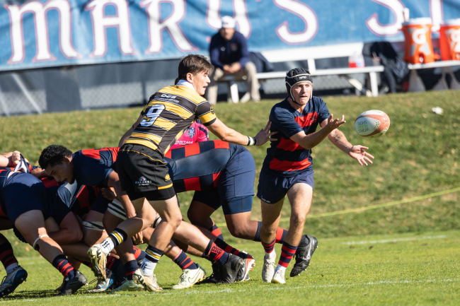 Hunter Modlin off loads the rugby ball during the match up against Long Beach State