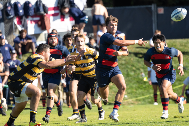 Oliver Cline passes the rugby ball