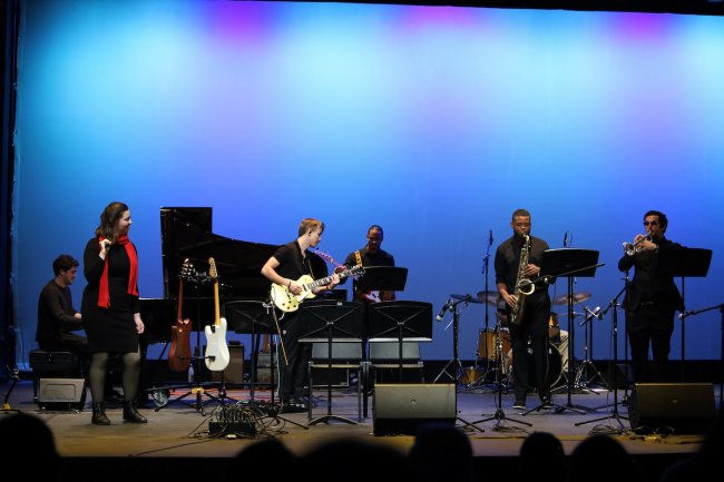 Jazz singer Ashlyn Storie sings on LeFevre stage with the jazz band accompanying her.