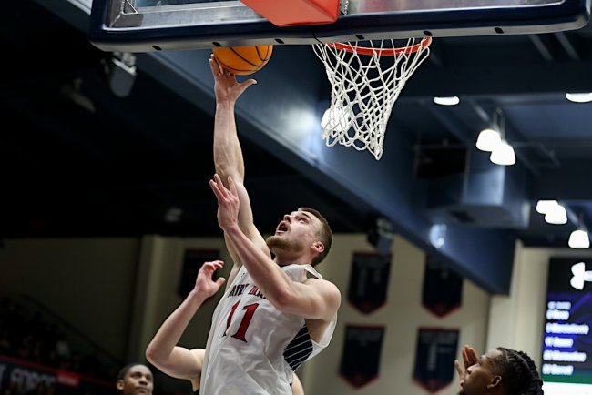 Men's basketball player Mitchell Saxen shoots against Pacific in December 2024