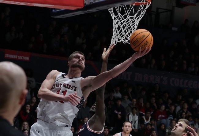 Men's Basketball player Mitchell Saxen shoots against Pepperdine in January 2025