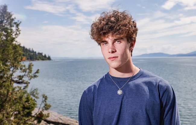 Student Kian Tanner '27 with Flathead Lake, Montana, in the background