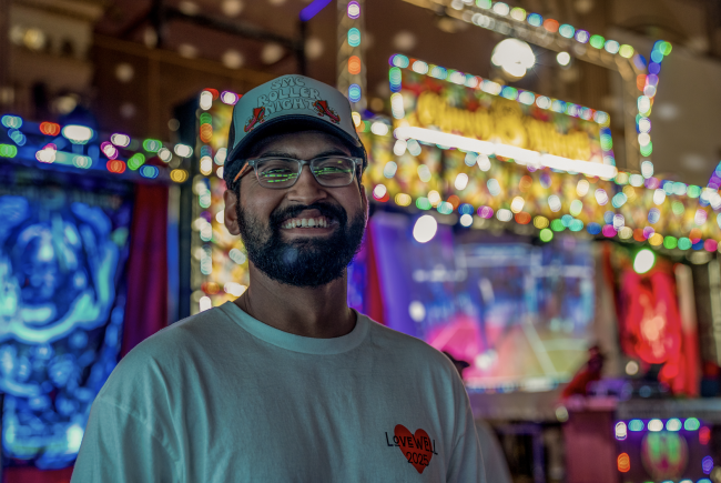 Bright Smile: Advait Powdwal ‘25 smiles for the camera during the SMC Roller Night event co-sponsored by BSU on Friday, Feb 21, 2025. / Photo By Francis Tatem.