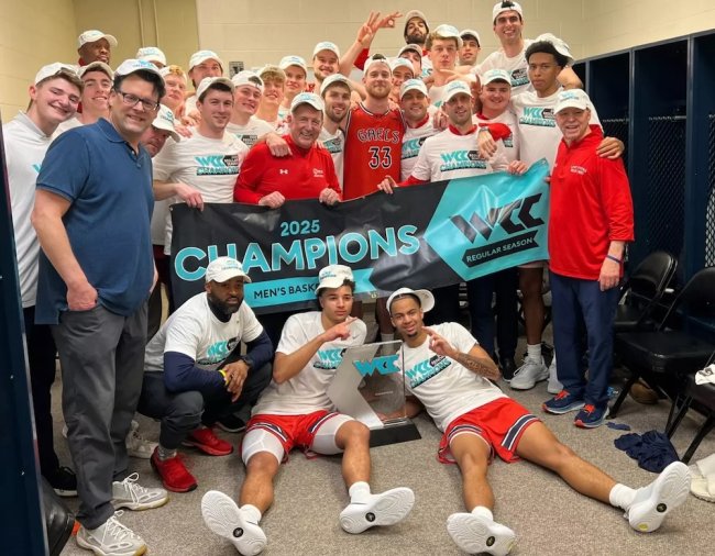 Men's basketball team celebrates 2025 WCC Regular Season Championship in the locker room in Spokane in February 2025