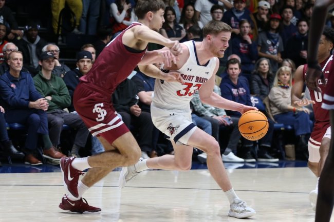 Men's Basketball player Luke Barrett drives against Santa Clara in February 2025