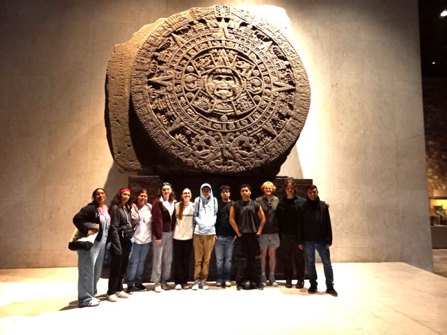 Students in front of Mayan calendar