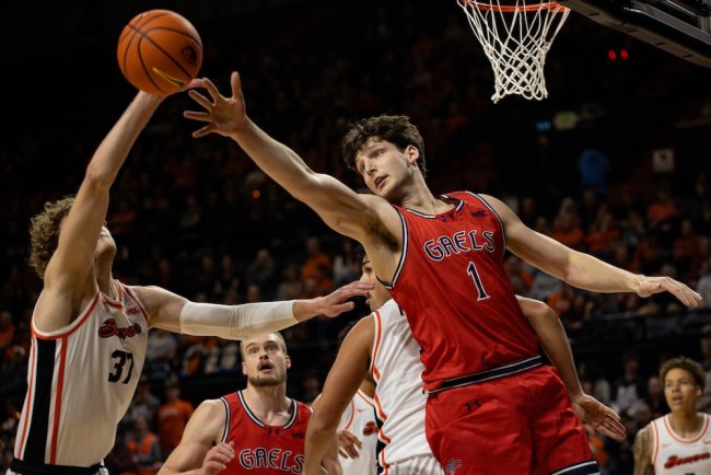 Men's Basketball player Harry Wessels blocks against OSU in February 2025