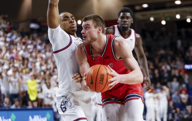 Men's Basketball player Mitchell Saxen drives against Gonzaga in February 2025
