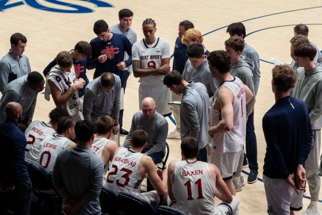 SMC basketball Head Coach Randy Bennett sits and talks with the team when they play Gonzaga in February 2025