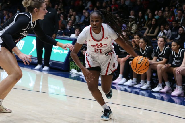 Women's basketball player Kennedy Johnson drives against Santa Clara in 2025