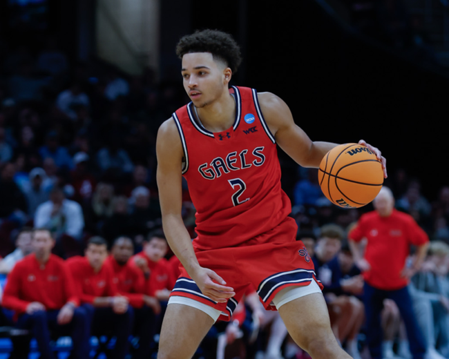 Men's basketball player Jordan Ross drives against Alabama in the NCAA Tournament 2025