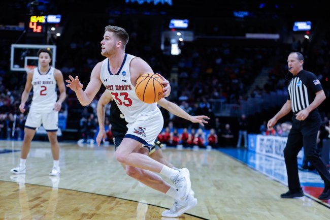 Luke Barrett driving down the court