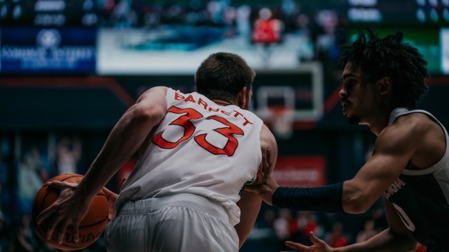 Men's Basketball player Luke Barrett drives against Gonzaga in February 2025