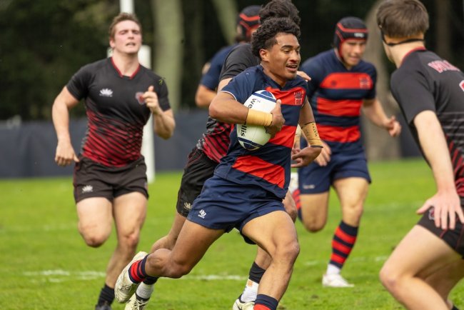Men's Rugby player Aisake Tukuafu ’28 runs with the ball against Central Washington in February 2025