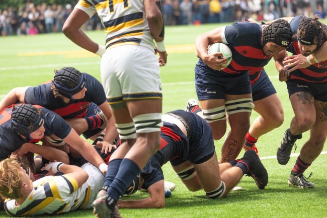 Men's Rugby Player Sione Ofa carries the ball against Cal in March 2025