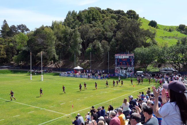 Gaels charge onto the field in the match against UCLA in April 2025