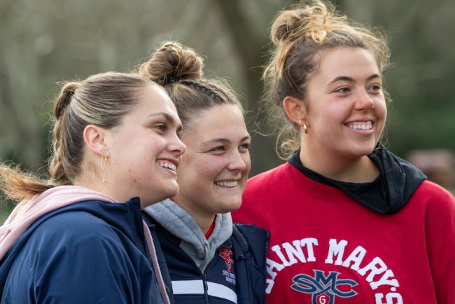 Rowing Assistant Coach Olivia Watson, right, with two rowers in March 2025