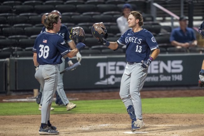 Baseball players Ian Armstrong and Eddie Madrigal meet at the plate in 2025 WCC Tournament against Gonzaga