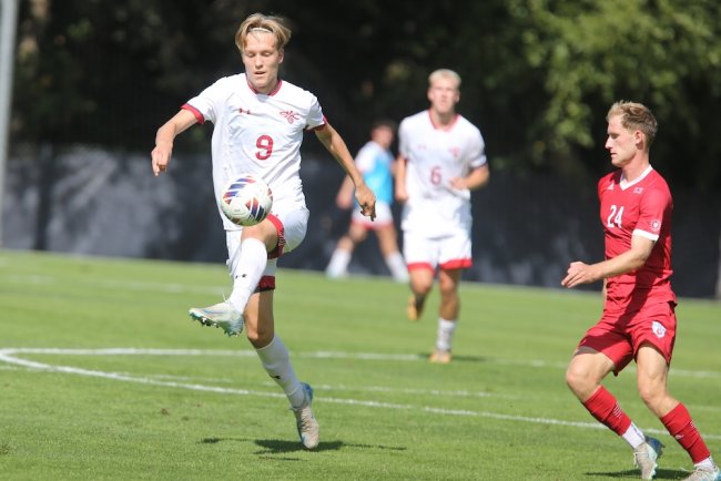 Men's Soccer player Jack Vestberg kicks the ball against LMU in October 2024