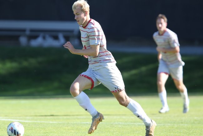 Men's Soccer Player Bastian Toelhoej dribbles the ball against USF in November 2024