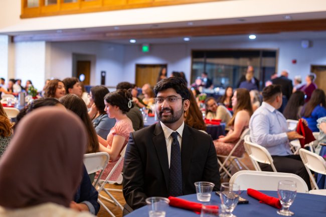 Student conversing with others at Student Leadership Celebration