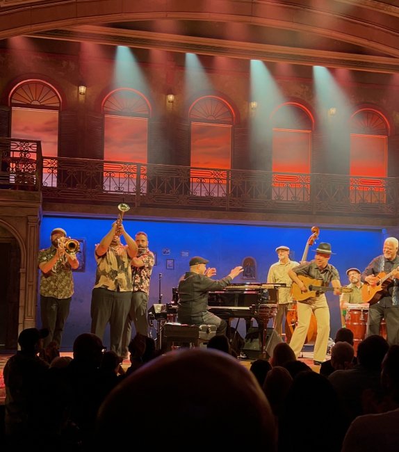 Nick Perez plays the piano amongst ten other band members