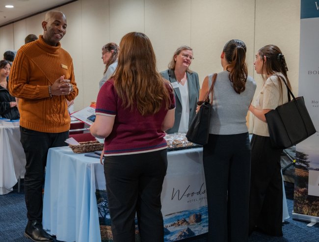 Recruiters from Woodside Hospitality Group speak with SMC students