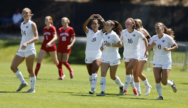 Group of women soccer players running and celebrating, fall 2025