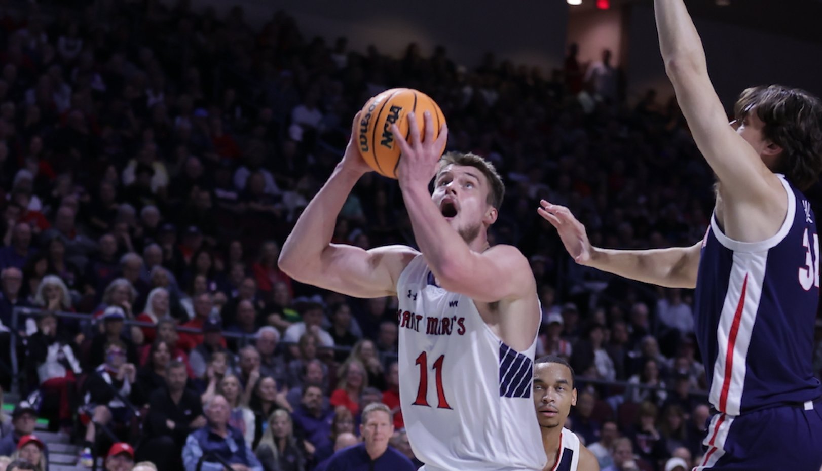 Men's Basketball player Mitchell Saxen shoots against Gonzaga in WCC Championship 2024