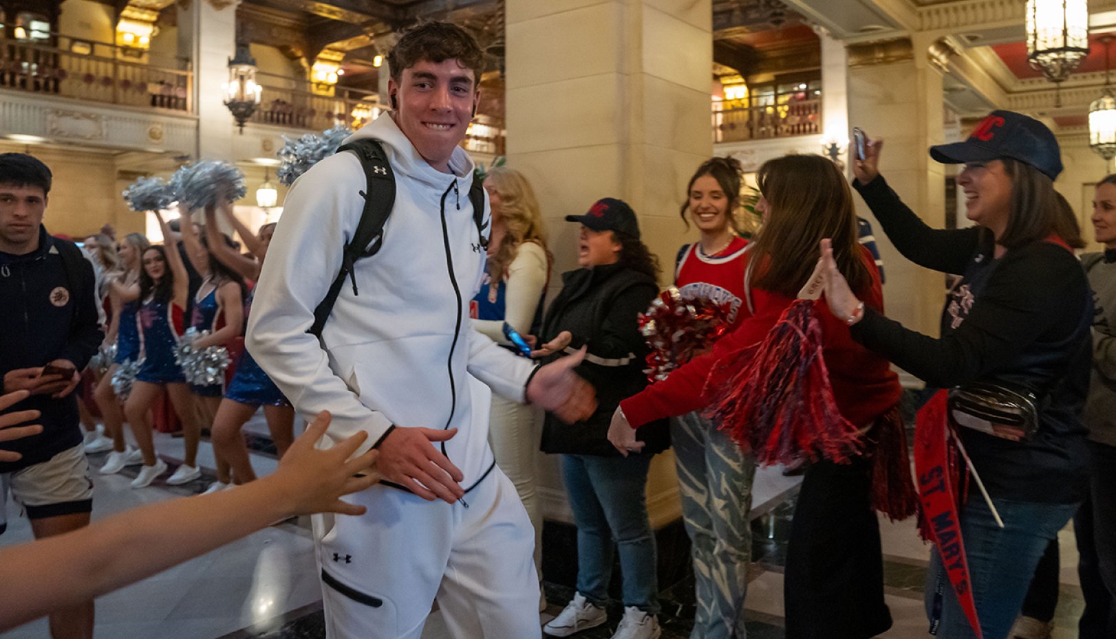 Fans cheer for men's basketball player Rory Hawke at 2024 NCAA Tournament Pregame Party